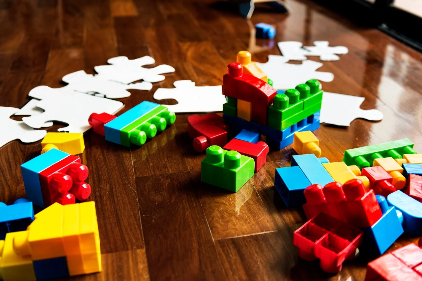 kid-toys-wooden-floor_53876-47076